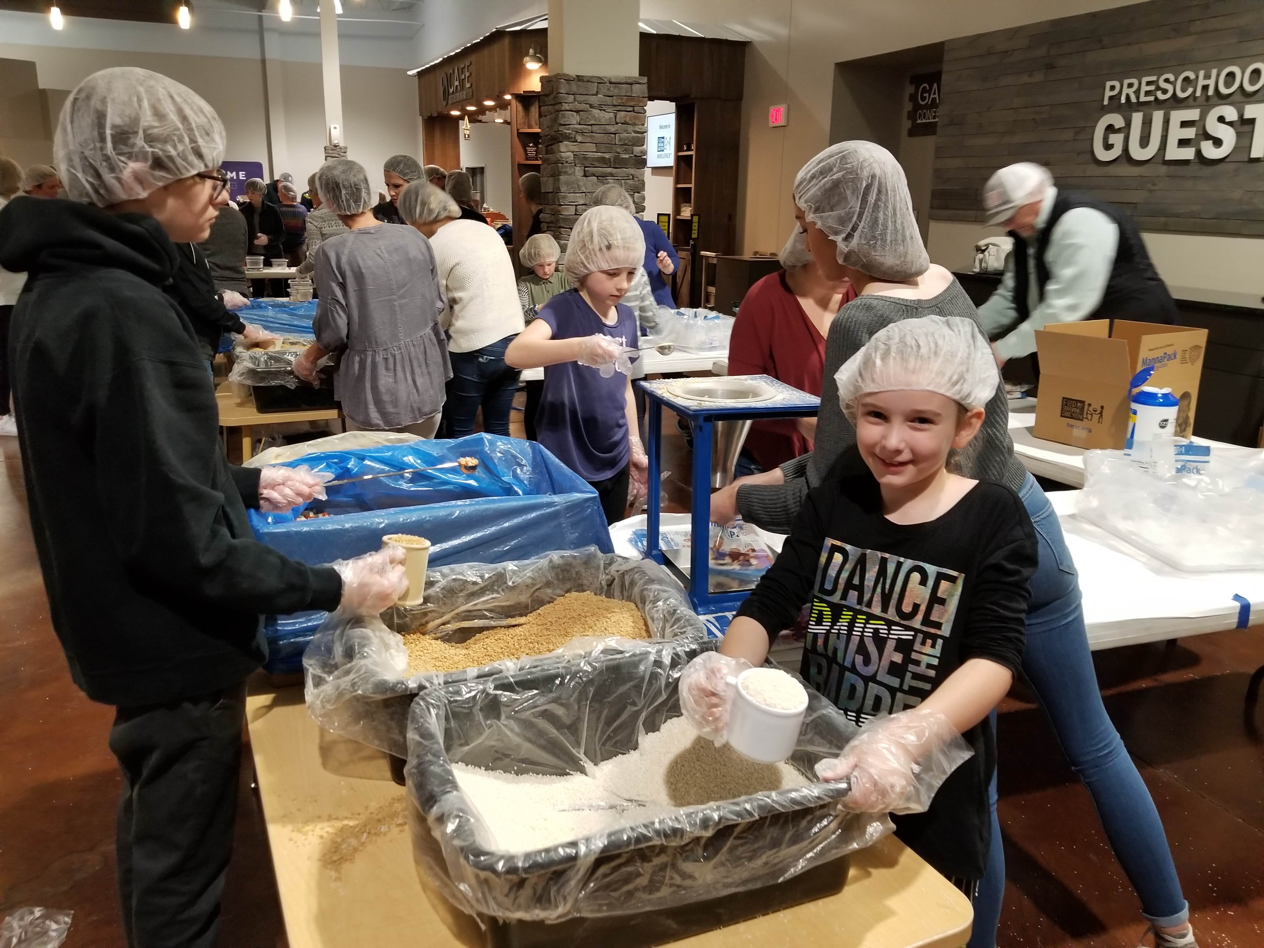Packing food for starving children